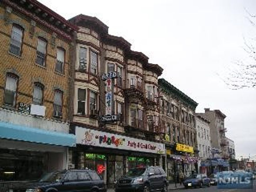 Great Investment property two stores approx. 2500 sq feet each and ten apartments plus a high ceiling finished basement. Gas heat, municipal parking lot behind the building. Great location Stores will be delivered vacant at closing.