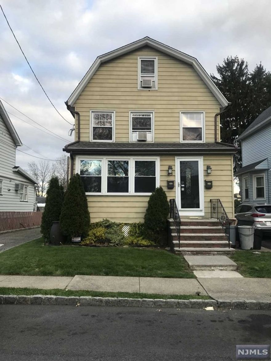 This 4 bed 2 1/2 bath house has many updates and hardwood floors throughout. Kitchen has all stainless steel appliances and quartz counter tops. A bright and sunny front 3 season room closed porch w/french doors. Living room, Dining Room Open Floor Plan. The 2nd floor has a newly renovated bathroom with soaking tub and separate shower. The main bedroom has a nice size walk in closet. Full open basement with a new bathroom and washer/dryer. Great for additional storage. There is a grass yard with a concrete area that is perfect for a grill. 2 parking spots with additional off street parking. Walking distance to Brookside Park. Close to NY Transportation. Minutes from GSP.