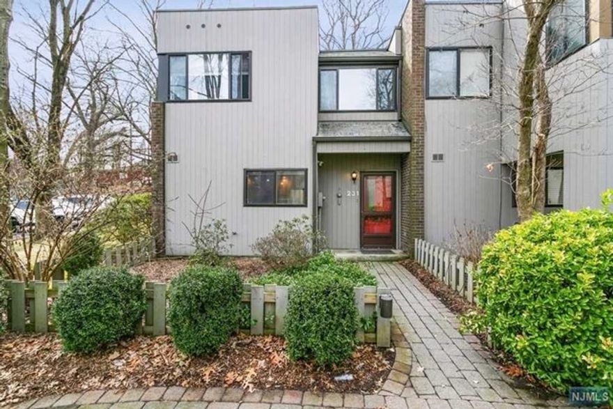 Beautiful Bright Corner Unit with Two Story Entry foyer, All Freshly Painted, New custom Flooring , Spacious rooms Wood burning fireplace, plus so much more. Step into this highly sought after End unit with private rear brick patio. Ample Storage. New Primary bath, 2 parking spots Pool, Tennis Court