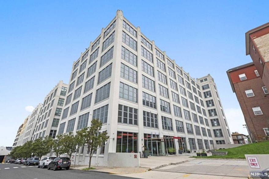 Welcome to the highly sought-after iconic Canco Lofts! Move right into this well-maintained fantastic community with endless amenities like a 24 hour-doorman, community and party rooms with kitchen and bar area, kids playroom, separate screening room, excellent exercise rooms with separate basketball area, outdoor picnic area, and dog run, to mention a few. This well-appointed one-bedroom features an open floor plan, with 14 Ft. ceilings and 11 ft. windows, all upgraded appliances, a newer central air unit, and a top-of-the-line washer/dryer, a short walk to the Journal Square Station or you could take the shuttle Mon-Fri. Come make this amazing unit your next home or your home away from home!!