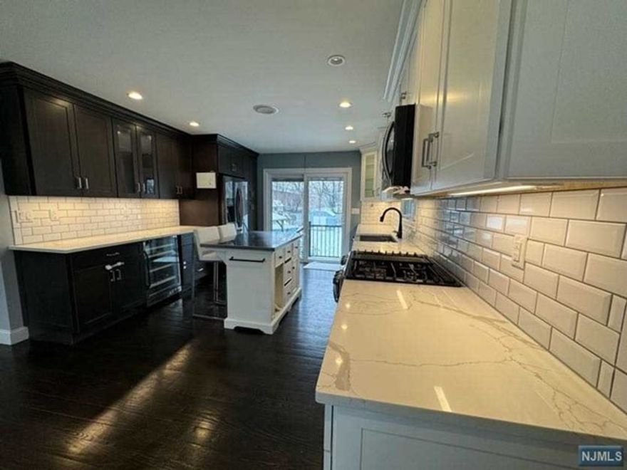 Welcome to this beautiful renovated apartment for rent in quiet residential area of Lodi, NJ. It features 3 bedrooms with costume made light up closets, 1 full bathroom, a nice modern open concept kitchen with quartz countertops, light up cabinets, stainless steel appliances, an integrated wine fridge, Dishwasher, Dining room and living room area with sound proof system. It also offers the usage of the front porch, WASHER AND DRYER in the basement, up to 3 CAR PARKING SPACES and ALL UTILITIES are INCLUDED. It is conveniently located to the major routes 46 & 80 and it is approximately 13 minutes to NYC. Do not miss the chance to rent this gem, it won't last.