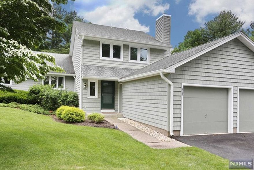 Welcome home to this beautiful 2-bedroom, 2 1/2 bath townhouse located in Ramapo Ridge. Step through the door into the sun-filled first floor featuring hardwood floors and sliding glass doors leading onto the deck. Open concept for entertaining with large living room w/charming window seat and bay window. Eat-in kitchen features granite countertops and gorgeous glass tile backsplash and new stainless appliances. Move right upstairs to the master bedroom suite with walk-in closet, spacious 2nd bedroom, and laundry. All new carpeting on the second floor. Like to entertain outside? The large deck off of the living room opens to a spacious, tree-lined green lawn, perfect for a barbecue. Walk to the clubhouse with fitness center, outdoor pool, tennis/ basketball courts, and game room. Great location close to all major highways, shopping, and schools.