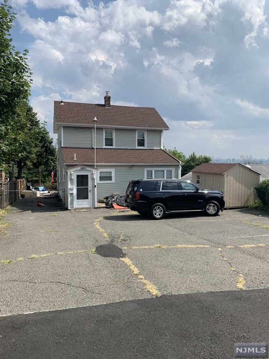 Come home to the secluded privacy of this single family home with amazing views of NYC; still having access to NYC transit, major highways. The first floor has been updated to open concept living; kitchen boasts cherry cabinets & granite counters with a movable island. Dining area features beautiful stone chimney highlighting some character in the space. Sliding doors lead to the deck to enjoy the sunsets with a view of NYC. 1 bedroom with attached Jack & Jill bath completes the first floor. Second floor has 2 additional bedrooms, full bath, with access to pull down attic for additional storage. This property has an easement from 519 Hackensack St to gain access.