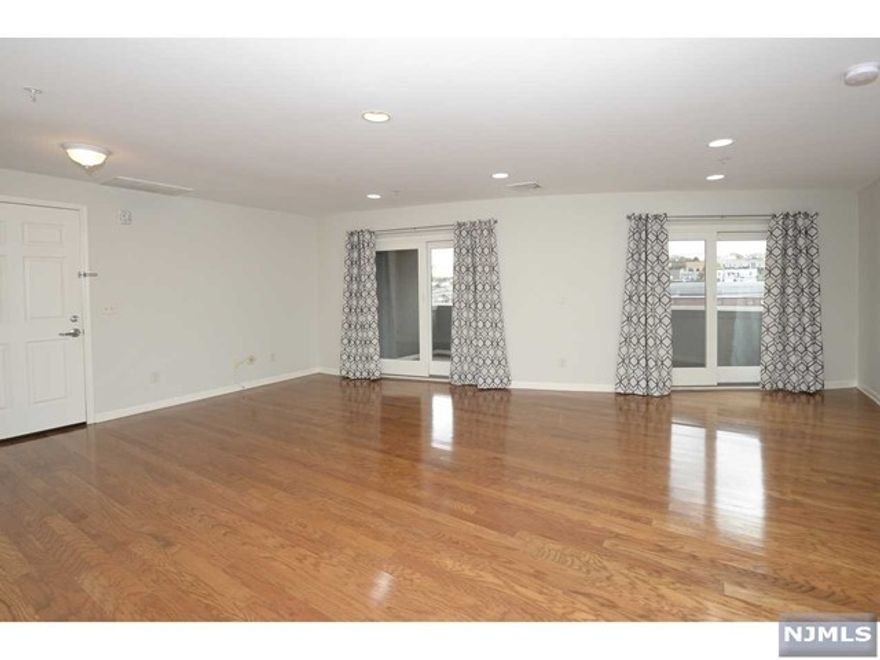 Rent in the heart of downtown Ridgewood. One bedroom apartment with Southern exposure. Modern kitchen with stainless steel appliances, beautiful dark hardwood floors, open layout with tons of natural light, balcony with view of downtown Ridgewood, central air, washer and dryer in unit and designated parking for 1 car. There is nothing else comparable in downtown Ridgewood at this price. No smoking, may consider small pet. May consider short term.