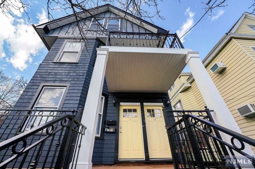 The one you've been waiting for, the location, size, updates & features galore. Modern amenities meet old-world charm right across the street from the Hudson-Bergen Light Rail station. This 2 family home features All new kitchens, both with Emerstone quartz countertops, new ultra-high-end appliances, artistic tile flooring, a farm sink with Perrin & Rowe Faucet, custom navy-blue stained Shaker cabinets with antique brass hardware, Built-in Miele dishwasher with cabinet panel, Stainless steel hood exhausting to outside and more!