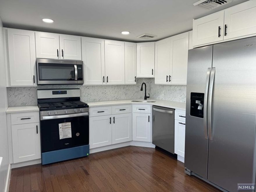 Welcome to this beautiful second floor apartment located on a quiet street of Saddle Brook. Head upstairs to find a stunningly renovated 2 bedroom apartment equipped with eat in kitchen, living room and brand new bathroom. This apartment offers loads of bright & natural lighting. Kitchen features new stove, refrigerator and dishwasher. New hardwood flooring throughout. New forced hot air & central a/c installed this year! Freshly painted. Conveniently located near Rt 46 & Rt 80. Close to shopping, transportation, restaurants and so much more! Tenant pays gas & electric. Attic storage included! Available ASAP No pets.