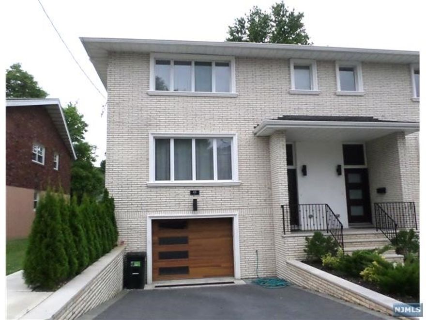 TOTALLY RENOVATED TOWNHOUSE LOCATED ON QUIET STREET WITHIN PROXIMITY TO NYC TRANSIT, SHOPPING, AND DINING. THIS THREE BEDROOM UNIT FEATURES AN OPEN FLOOR PLAN ON THE MAIN LEVEL WITH HARDWOOD FLOORS AND MOLDINGS THROUGHOUT, MODERN EAT IN KITCHEN WITH STAINLESS STEEL APPLIANCES, AND DINING ROOM...MASTER BEDROOM WITH WALK IN CLOSET, SPA LIKE MASTER BATH WITH DOUBLE VANITIES...PLUS TWO ADDITIONAL BEDROOMS AND A HALLWAY BATH. GROUND LEVEL WITH TWO CAR GARAGE, TILED RECREATION ROOM, AND FULL BATH.