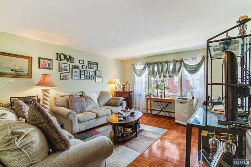 Welcome !!! This Spacious and well cared for top-end unit condominium is located near everything, Ridge Rd shopping Stores, Restaurants, Bus, and Train Station with EASY COMMUTE TO NYC Offers a formal Living room, Kitchen, Dining room, and large bedroom, with plenty of closet space, a new full bathroom, in-unit laundry room additional Storage space in the Basement hardwood floors throughout, and one parking space in the rear of the building