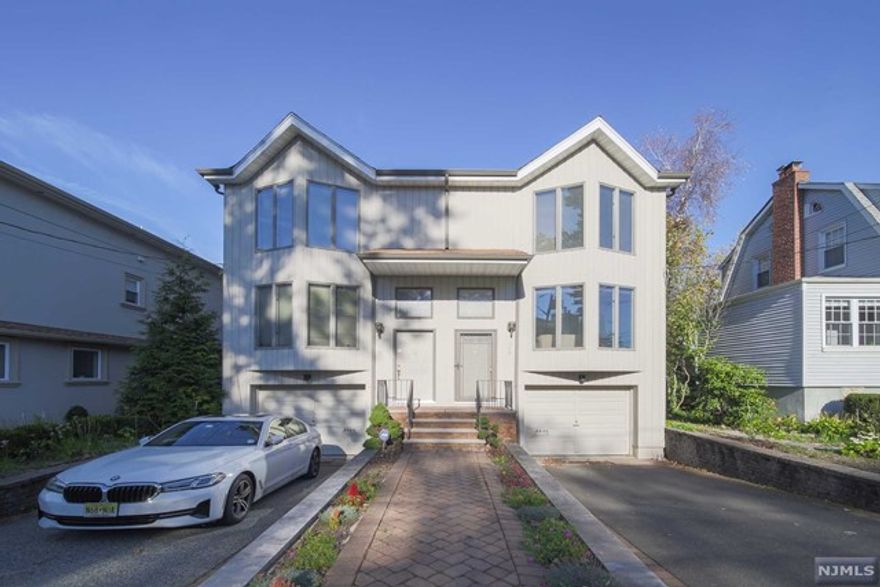 WELL MAINTAINED CHARM DEULEX HOUSE in the heart of the town - Fort Lee. Bright and sunny living room facing south. Attractive appearance with a special triangular bay windows. Skylight ceiling in the 2nd floor hallway. Good size of Terrace. Open lay out with spacious living room & Family Room with fire place. Stainless steal appliances in the kitchen and hardwood floor through out. Kitchen Cabinet, Appliance, Water Heater, and Boiler are 5 years old. Barbeque Grill is connected with public gas system and included in the sale. Ground unit has a separate side entrance door and full bathroom. Convenient transportation to commute NYC. MUST SEE IT !!! Don't bother homeowner directly, please contact Listing Agent.