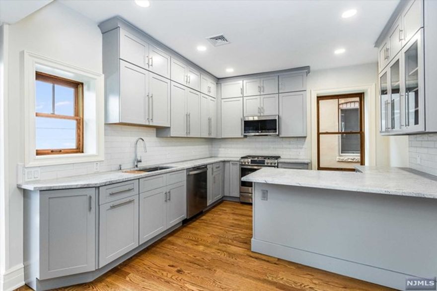 This 2 bed/1 bath second floor walk up apartment will take your breath away with impeccable finishes and thoughtful design. All of the boxes are checked - in-unit laundry, parking, HVAC, and outdoor space. Bask in the sunlight that pours into the south facing living room, illuminating hardwood floors w/ inlay, custom carpentry, coffered ceilings, and exposed brick. A sightline travels the eye from a custom window bench, past the entry hall, luxurious bathroom, all the way to the stunning kitchen. Two bedrooms anchor the center of the apartment with more exposed brick & custom closets. Cook up a masterpiece in the expertly designed kitchen with all new everything. You will be spoiled by the 5 burner gas range with ventilation, all custom cabinetry, breakfast bar, and pantry. All of this and more with the BEST location in town - Walnut St Station, Farmers Market , restaurants and more!