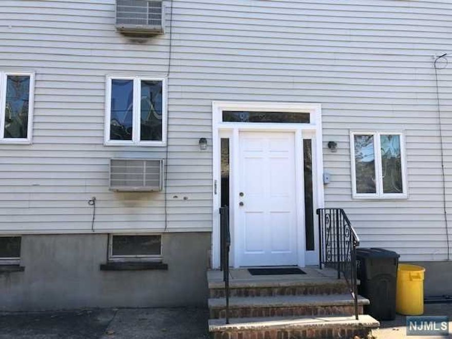 Landlord pays 1/2 fee. One bedroom apartment on first floor, close to PATH. Large living room, ample closet space. Includes refrigerator. Small courtyard to share. No pets.