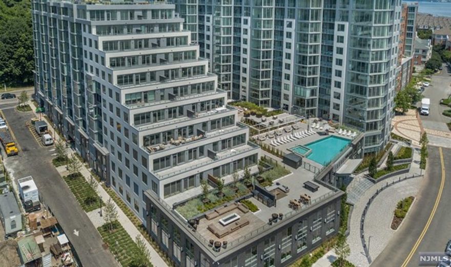 Penthouse living at an amazing price point with amazing views. This two bedroom two bath unit with over 1700 sqft of living space is now available at Nine on the Hudson. The open living area with living/dining room & gourmet chef's kitchen featuring Bosch appliances, Thermador built-in refrigerator, Italian Pedini cabinets, & Quartz Stone countertops. A master suite comprising a walk-in closet & ensuite bathroom with full marble floor & walls, Quartz vanity countertops, Moen faucets, rain shower, & glass shower door and in-unit washer & dryer and indoor parking. This premier luxury new construction building is located along the NJ Gold Coast waterfront. The ultimate lifestyle building offers 24-hour conceirge, two story health club, resident lounge space, pool and bbq deck, rooftop deck and so much more. Taxes are based on the PILOT abatement program.