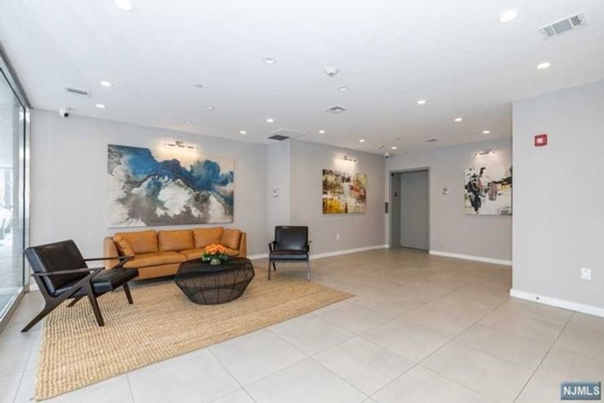 Top Floor corner unit! - The Cosmopolitan, a boutique style rental building just a walk to Fort Lee downtown; Hudson lights, iPic theater, restaurants and shopping. Beautifully designed and decorated lobby, secured building with access panel and cameras. The apartment offers 9-foot ceilings & Open floor plans Kitchen, Living and Dining. The Custom kitchen offer all white high end 42" cabinets with black granite counter tops. All GE appliances, Gas cooking and overhead microwave with exhaust hoods. A large master bedroom, master bath and a walk-in closet. A spacious 2nd bedroom with a full bath and walk in closet. All 8-foot windows allow lots of natural light and a spacious modern interior. An assigned car space is included. Easy walk to center of town, parks, shopping, cafes, and NYC transportation. A walk to GWB. Great location, beautiful apartment!