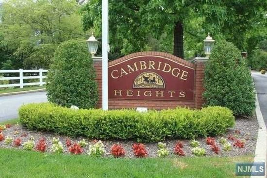 Welcome to this updated and meticulously maintained 2 bedroom/3 bath unit in Ramsey's sought-after gated community of Cambridge Heights. The open floor plan of the dining room and living room with fireplace, along with a spacious loft with full bath and storage, are just the beginning! The updated kitchen features wood cabinetry, granite countertops, under-cabinet lighting and stainless steel appliances. Laundry closet and additional storage closet are provided in the hallway. The large ensuite primary bedroom with two closets and a 2nd bedroom and full bath complete the main level. Sliding doors on either side of the fireplace lead to a deck to relax and enjoy the beautiful wooded backdrop. Garage located under building (1 indoor/1 outdoor spot). Cambridge Heights features include clubhouse, fitness room, outdoor pool, basketball/tennis courts, as well as NYC bus pickup at the 24-hour gatehouse and easy access to Ramsey's downtown shops and transportation. Don't miss out!