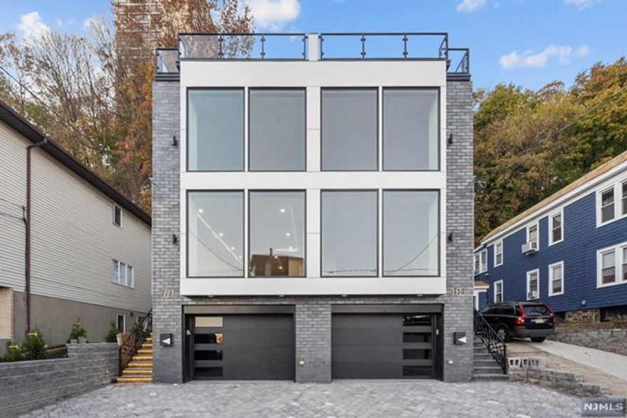 NEW CONSTRUCTION LUXURY DUPLEX. THIS OVERSIZED TOWNHOME IS ONE OF THE LARGEST NEW CONSTRUCTION IN EDGEWATER NEW JERSEY WITH STUNNING VIEWS OF THE NYC SKYLINE AND HUDSON RIVER. APPROX. 4500 SQFT/ 4 LEVELS WITH 9FT CEILINGS/ 4 BEDROOMS / 3 FULL BATHROOMS 2 HALF BATHS AND MAGNIFICENT 1000 SQ FOOT WRAP AROUND ROOFDECK. 2 CAR GARAGE, ANDERSON WINDOWS, PRIVATE ELEVATOR, CUSTOM KITCHEN AND BATHS, CUSTOM GLASS WALLS AND WRAP AROUND KITCHEN ARE SOME OF THE FEATURES INCLUDED IN THIS HOME. KITCHEN WITH PROFESSIONAL GRADE APPLIANCES AND 11 FOOT CENTER ISLAND. LARGE PRIMARY BEDROOM WITH SPA LIKE PRIMARY BATH,. TOP FLOOR HAS ENTERTAINMENT ROOM, WET BAR WITH ACCESS TO ROOF AND BATHROOM. FRONT AND REAR ROOF DECKS, FRONT DECK IS PARTIALLY COVERED AND SET UP FOR OUT DOOR TV