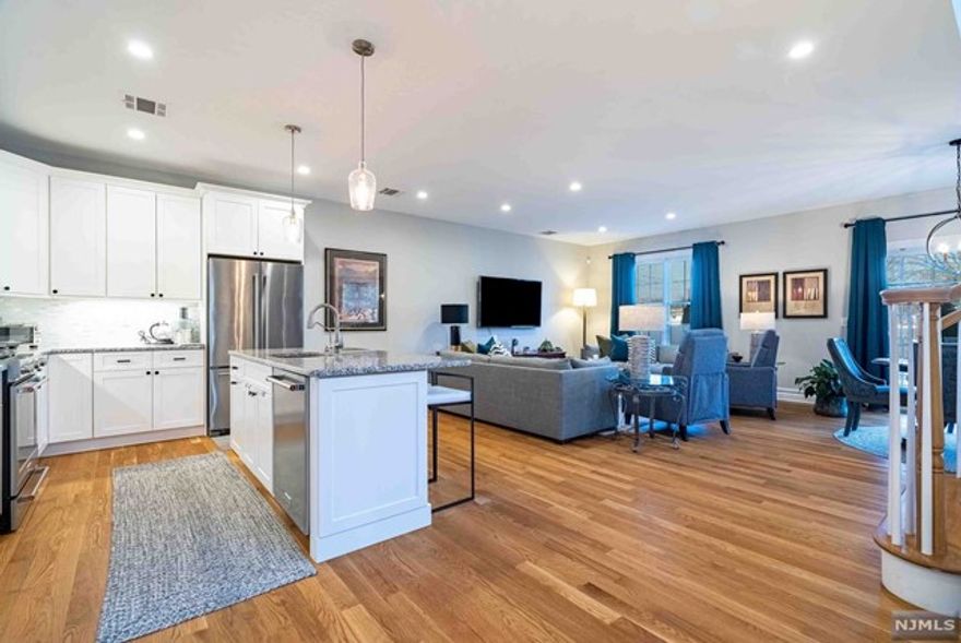 Welcome to Paris Square, Bergen County's premier community for adults over 50+. This move in condition end unit is light and bright with many windows on three sides. Beautiful white kitchen with granite countertops and stainless steel appliances, water purifier system, and an open-concept design that flows from the family room into the dining area. First floor den could be converted to a 4th bedroom next to the full bath. On the second floor there is a master suite with two walk in custom california closets and a spa like bathroom with double sinks ,large walk in shower and marble tile. Two bedrooms, full bathroom, and a laundry room complete the second floor. Amenities include a clubhouse, fitness center, outdoor pool, putting green, BBQ area and movie theater. Pet-friendly with a dog run on property. Nearby golf, shopping restaurants, hiking & transportation.