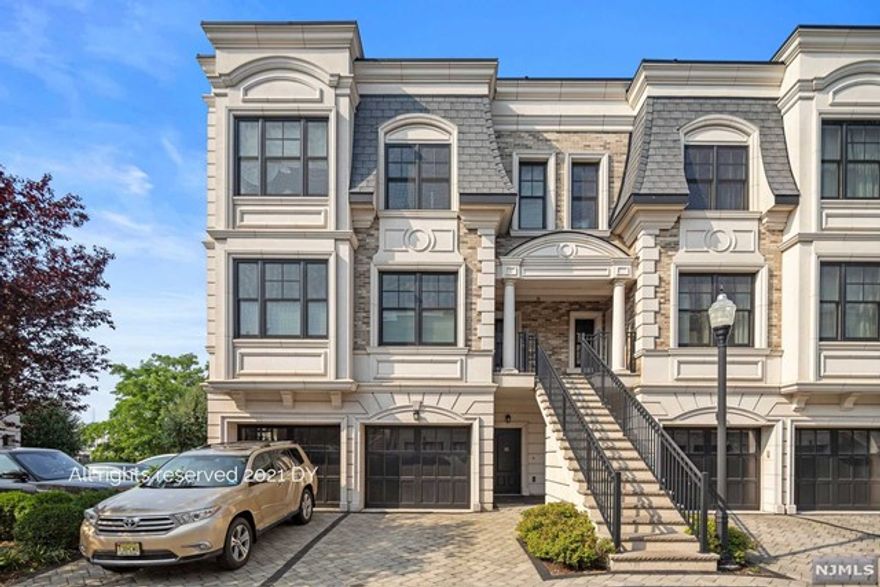 Exquisite Executive Townhome in Edgewater! Located in the highly coveted and gated waterfront community of Marquis on the Hudson, this 2BR/3BA, 1,570sqft property enthralls with stunning French Provincial architecture and meticulous landscaping. Step inside the immaculate interior to discover elevated living with an openly flowing floorplan, hardwood floors, tons of natural light, and high tray ceilings. Prepare gourmet meals in the chef's kitchen featuring stainless-steel appliances, granite countertops, richly toned shaker cabinetry, recessed lighting, breakfast bar, dining area, and a spacious living room with doors to the patio. Bask in true luxury in the expansive master bedroom, which has a deep closet, private balcony access w/river views, and a luxe en suite with a glass enclosed shower/tub combo. Other features: attached 1-car garage, additional parking space, top floor laundry area, quick commute to NYC, near shopping, restaurants, and shopping, and much more!