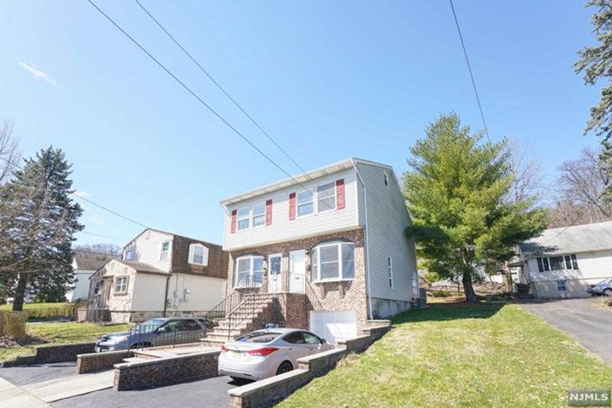 Move in ready, fully renovated, half duplex is everything you're looking for ! As you walk inside this one of a kind THREE STORY unit, you're welcomed with a large living room, half bathroom, laundry room, and eat in kitchen with stainless steel appliances on the first floor. Enjoy privacy with your own deck with a divider that separates you from your neighboring unit. Come on up to the second floor which features a big bedroom, your first full bathroom, and a master bedroom along with a master bathroom. Third floor features your private retreat with a large third bedroom where you have your own access to. This unit also features 1 parking spot in a separate driveway, use of yard, laundry in unit, and is pet friendly with conditions! Located close to parks, shopping centers, and walking distance to Goffle Brook Park and public transportation. Come take a look at this one of a kind unit, you don't want to miss out!