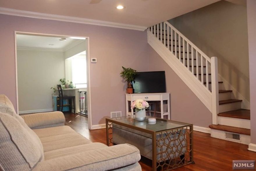 A great starter home for NYC commuters! The first floor has a bright living room, a separate dining room, and a cute kitchen with a breakfast bar. The second floor has 2 airy bedrooms and an updated full bath. Hardwood floors throughout. Part finished basement with washer/ dryer hookup. One Parking Space included. Low maintenance and low HOA fees. Quite community minutes from restaurants, gyms, places of worship and NJ transit.