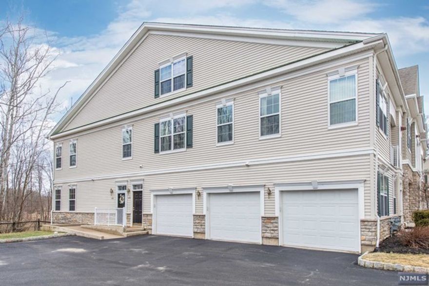 Beautiful 2 Bedroom, 2 Bath Dumont model in end unit, move in ready with an amazing private view from the terrace! Enjoy this spacious and bright townhome with vaulted ceilings and private covered terrace. Living and Dining area is adjacent to the kitchen which has a breakfast bar, granite countertops and stainless steel appliances. Primary bedroom has crown molding, WIC and full bath. Second bedroom is very welcoming with crown molding as well. You will love the large laundry room and huge walk-in storage closet. Enjoy your own garage and living close to transportation, dining and culture of downtown Morristown.