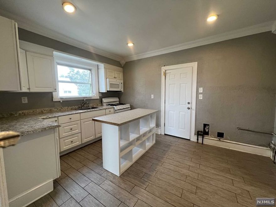 Renovated 2nd floor apartment with EIK, Full Bath, 1 Bedroom and Living Room. Hardwood floors and separate utilities. Tenant will pay Electric, Gas, Heat and Real Estate Fee. Landlord will pay Water. Refrigerator not included, tenant will need to supply. Elementary school 1/2 block away, laundromat 5 blocks away on Lanza Ave. Near shopping and transportation. Use of. shared backyard with other tenants.NO PETS. Bedroom 10x8, Living Room 12x8. 670 minimum credit score, credit history report and employment required with 3 paychecks and DL. Interview required and NO PETS.