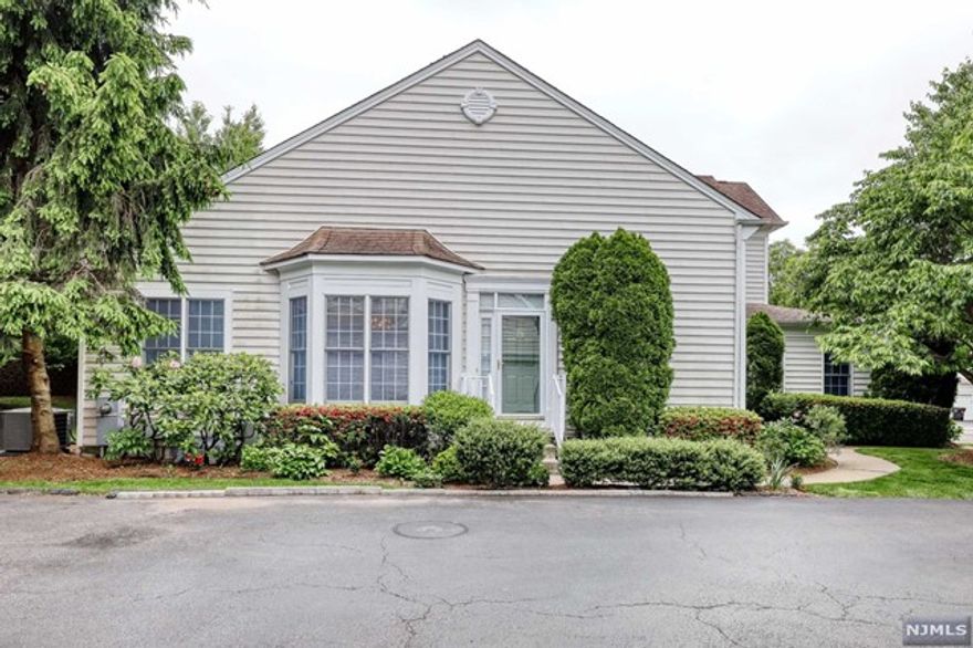 Sought after FIRST FLOOR MASTER BEDROOM End unit townhouse located in cul de sac with plenty of guest parking. Original owner kept home immaculate. Hardwood floors thoughout first floor living room, dining area, family room w/ gas firplace, eat in kitchen w/ large private deck, granite counters, tile backsplash, stainless steel appliances all replaced in last 3 yrs. Master bedroom with tray ceiling, walk in closet, master bathroom with jacuzzi tub, separate seamless shower stall, double sink and separate vanity and water closet, luandry and powder room complete the first floor. Second floor has bright spacious loft with two large bedrooms and jack and jill bathroom, with newer carpet. NYC bus across the street, low maintenance, all mini school buses pick up children. Just come and unpack. Will not last!