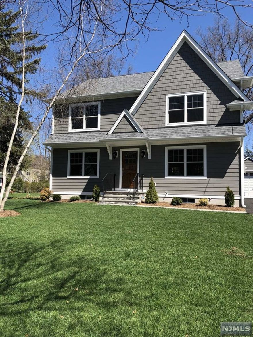 Welcome to this 4-bedroom, 2.5-bath Center Hall Colonial in the desirable Ridgewood, built in 2018. This meticulously maintained home offers a blend of modern amenities and comfortable living spaces. Step into the bright and airy white kitchen, complete with high-end appliances that make cooking a joy. The first floor features a formal living room, formal dining room, a spacious family room and powder room. On the second floor, you'll find the master bedroom with an en-suite bath, providing a private retreat. Additionally, there are three generously sized bedrooms and a full bath with double sinks. The finished basement adds valuable extra space, perfect for a home office, gym, or cozy entertainment area.the fenced-in, level yard is ideal for outdoor gatherings. Additionally, there's an electric vehicle charger for your convenience. Close to elementary school!