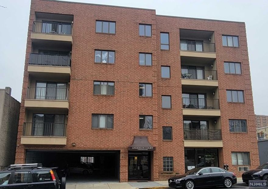 Meticulously kept, 2 bedroom corner unit with much to offer. Inviting open floor plan to large living room with a terrace overlooking local city life. Lovely modern galley kitchen with stainless steel appliances and separate dining area. Spacious Master bedroom suite with private updated full bath, second bedroom of average size, and updated main bathroom. Ample closet space throughout the unit. Newer central heating and cooling unit, and new hot water heater. Convenient onsite laundry located on every floor. 24hr secured building with elevator. One indoor assigned parking space. Local and NYC public transportation, local school, shopping & eateries are just steps away! A must see!