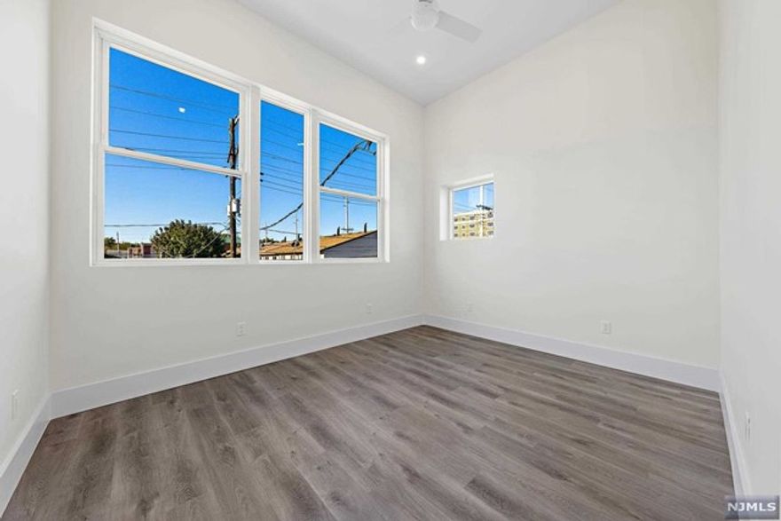 NEW CONSTRUCTION is around the corner from the Rutherford train bus station! Quick 25 minute commute to Manhattan! Loft style apartment features 2 bedrooms, 1 bathroom, CENTRAL AIR, IN UNIT WASHER DRYER, 1 OUTDOOR PARKING SPACE with EV charging hook up, 12 foot ceiling, Juliet balcony, partial NYC view, oversized windows, video intercom and security system. Modern kitchen equipped with Grohe fixtures, stainless steel GE appliances, quartz countertops, and soft close white shaker cabinets. Walking distance to the gym, Park Ave restaurants, shops and more! 1 GARAGE AVAILABLE $250 MONTHLY. NTN Credit check, photo ID & Proof of Income are required to apply. NO PETS. NO SMOKING ALLOWED ON OR NEAR THE PROPERTY. Renter's Insurance is required.