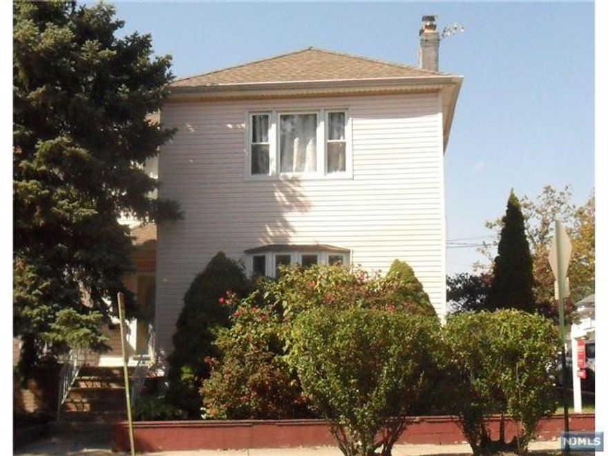 Freshly painted 3 Bedroom Apartment with an updated Bath. Large Living Room & Dining Room. This apartment is complete with a Decorative Fireplace, Laundry in the Basement and a Shared 2 car garage (1 space).