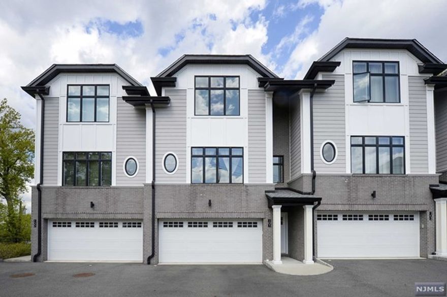 Welcome to luxurious living in this tastefully designed townhouse nestled in Ridgefield. This impeccably crafted residence boasts 2 bedrooms and 3.5 bathrooms. Conveniently pull into the 2-car driveway and step inside to discover the ground-level floor, with a spacious rec room and a full bathroom. Ascend to the first floor, where an inviting living room, elegant dining room, and modern eat-in kitchen a gourmet kitchen adorned with quartz countertops and stainless steel appliances await. Step outside onto the deck accessible from the dining room, offering a serene spot to enjoy the fresh air. Venture upstairs to the second floor, where luxury awaits in a primary bedroom suite boasting an en suite bathroom. Another bedroom and full bathroom complete this level, providing ample space. With its thoughtfully designed layout, high-end finishes, and prime location, this designer townhome offers the perfect blend of sophistication and functionality.