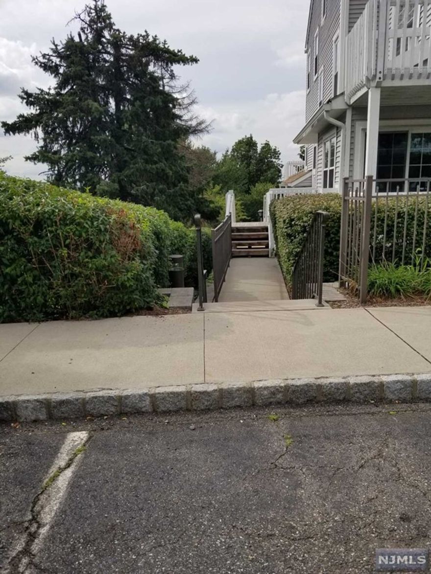 Beautiful 2 bed 2bth with full finished basement and laundry room w/ full size w/d. Unit is conveniently located with few steps to front door. Hardwood floors throughout. This unit is immaculate and shows really well. Updated kitchen and baths. Basement is huge - totally finished and has a laundry room with full size w/d. Fireplace and Terrace facing east. Complex has plenty of parking, pool, tennis and bar-b-q area. Close to all local conveniences, NYC trans, and all major highways. SORRY NO DOGS. No Friday or Saturday showings.