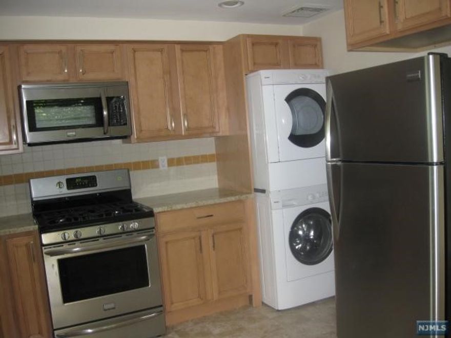 Very convenient location. Bus is on the corner. 2 outside parking spaces are included. Large private back yard. Close to schools & shopping. Updated kitchen with stainless steel appliances. Refrigerator, Microwave dishwasher and self cleaning gas range.. Kitchen has maple cabinets and granite countertops Hardwood floors in living room. Newer carpet in bedrooms and hallway. Ceiling fans in bedrooms and living room as well. Extra closet storage in living room. Central air conditioning. Short term or a month to month rental will be considered. Pets are conditional. Photos show carpet in living room. Hardwood is exposed now.