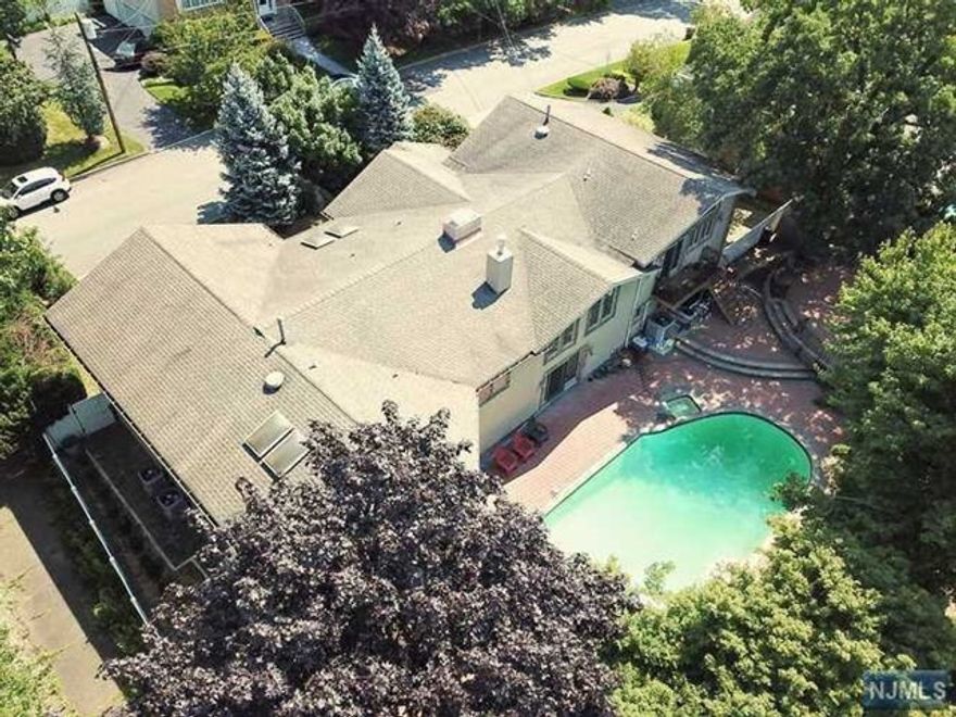 Built by the owner in 2004, over 6,000 SF very spacious interior w/ new exterior and special features; radiant heat floor in kitchen, summer kitchen, huge recreation room, new beautiful patio, 2 fire places, washer & dryer each level, 3 zone HVAC, and spacious parking space. All updated & maintained house. Any minute sot access the GWB & NYC.