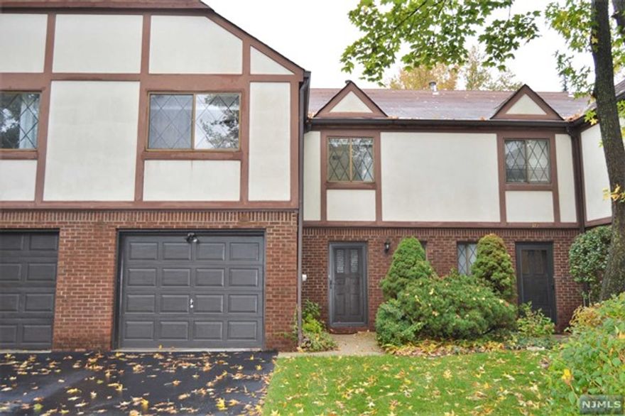 Lovely, spacious townhouse, newer light fixtures. Hardwood floors. Patio off living room. Laundry in kitchen in unit. Close to NYC transportation. Full credit check (not just credit score) and tenant application required.