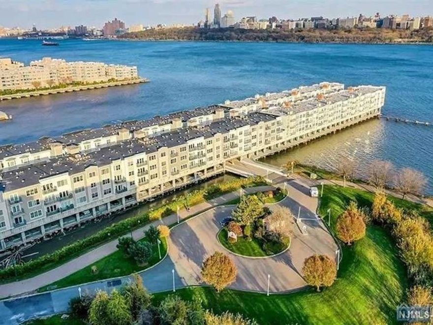 Enjoy the ease of luxury condo living in this substantial 3 Bedroom/2Bath home with stunning views of the Hudson River & NYC. Enter a generous foyer leading you to relax in this large Living Room with gas fireplace & Dining w/outdoor balcony access. The spacious Kitchen is open w/breakfast bar & newer appliances. Experience a Primary Suite featuring water views, access to balcony & Luxury Bath with tub & shower. Two additional Bedrooms and Full Bath are ideal! Renovations include new hardwood flooring throughout, new windows & balcony door, new w/d, new HW Heater. Garage parking spot included. The Promenade offers 24 Hour Gatehouse & Elevators, fitness center, sauna, jacuzzi & locker rooms. Just short walk to bustling City Place Restaurants & Shops,Transportation & the Hudson River Waterfront Walkway! Create your riverfront lifestyle in this thriving community.