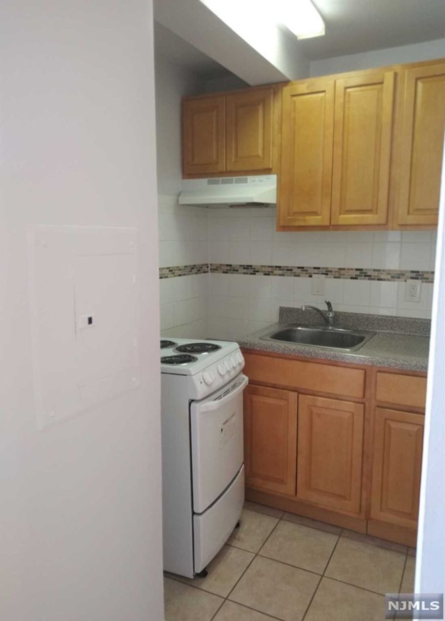 A perfect 12th floor Crash Pad!! Come Home to this updated 12th floor 1 bedroom, 1 bath efficiency coop. East facing with NYC views, this unit in a luxury high rise has an kitchenette, bath, generous bedroom. Most affordable place to live in Northern NJ. This popular co-op features a 24 concierge, included utilities (electric, heat, hot water), underground parking ($60/mo), complimentary jitney to the NYC train, a backyard gorgeous "secret garden" and first floor gym. Just blocks from access to GSP and Route 280, this is one of the best NYC views in Essex County! Coop approval and 20% down payment required. Owner occupancy - not for rentals. Shares - 180 . HOA includes taxes, maintenance and ALL utilities. See details on entrance requirements and fees.