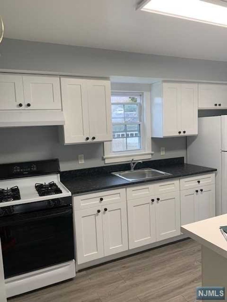 Come see this fully renovated 1st floor, 2 BR, EIK with granite counter tops, refinished hardwood floors, spacious living room and updated bath. Basement access with storage and laundry. Shared use of backyard & 2 car driveway parking. enant is responsible for utilities - Gas, Electric and Water all on separate meters for this apartment only. Owner has NJ real estate license.