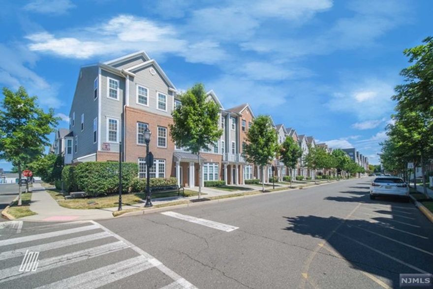 Contact Danny 917-300-8484 (info@79wesmontdr.com) for a tour! Tucked away in a coveted community steps from Dunkin Donuts, Wesmont Liquor Store, and a NJ Rail Station, this 2BR/2.5BA residence charms with classic colonial architecture, beautiful wood floors, and neutral paint hues. Brimming with natural light, the main-level features an open floorplan, spacious living area w/balcony, powder room, and an open concept gourmet kitchen with stainless-steel appliances, granite counters, pantry, and a gas range. Explore the top-floor to discover a marvelously-sized primary bedroom with vaulted ceilings, deep closet, and a spa-like en suite boasting a soaking tub, separate shower, and dual sinks. One additional bedroom, a loft, and a full bathroom finish out the upper-level. Other features: attached 1-car garage, laundry area, close to Costco, major highways, NJ buses, dog parks, playgrounds, baseball and soccer fields, and a running track, and more!