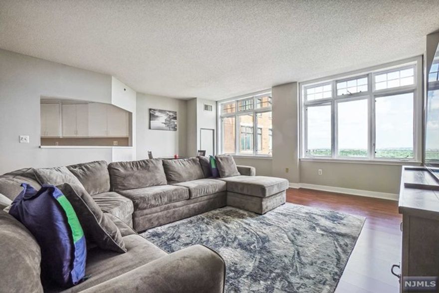 Welcome to luxury living at The Top! This fabulous sixth floor sun-filled unit has incredible NYC views and features new premium laminate wood floors in the Living Room and Dining Room plus new wall-to-wall carpeting in the Bedroom. The Kitchen features crisp white cabinetry and recessed lights and boasts a pass through to the Dining area. New LG washer and dryer and an updated Powder Room with a pedestal sink. Incredible Primary Bedroom with stunning views and a large walk-in closet with shelving. Luxe Bathroom with a white vanity, marble floors, jetted soaking tub and glass enclosed shower. Outstanding amenities include 24-hour security, indoor heated pool, gym, rentable party room, valet parking and a storage area. Premier location with Jitney service across the street offers easy access to NYC via South Orange and Maplewood train stations. Close to vibrant South Orange and Maplewood downtowns, and the South Mountain Reservation.