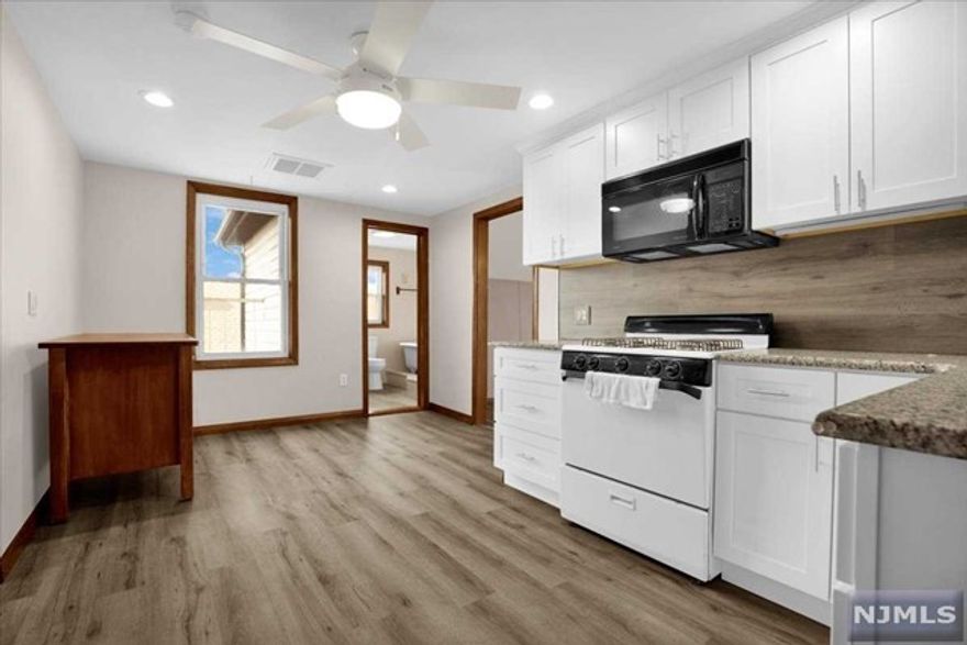 A perfect combination of contemporary style and charming vintage character, this newly renovated top floor apartment features 2 bedrooms and 1 bathroom with an additional bonus room perfect for an office or nursery. Eat-in Kitchen boasts shaker cabinets and granite countertops. Bedrooms feature large windows and plenty of closet space. Apartment equipped with central AC. Coin operated laundry on site. Conveniently located with easy access to public transportation and local amenities. Tenants share backyard and driveway. Tenants responsible for snow removal, LL takes care of lawn. Minimum 650 Credit Score. Please submit NTN Report and 2 months pay-stubs with application. Hallways will be painted after tenant move in.