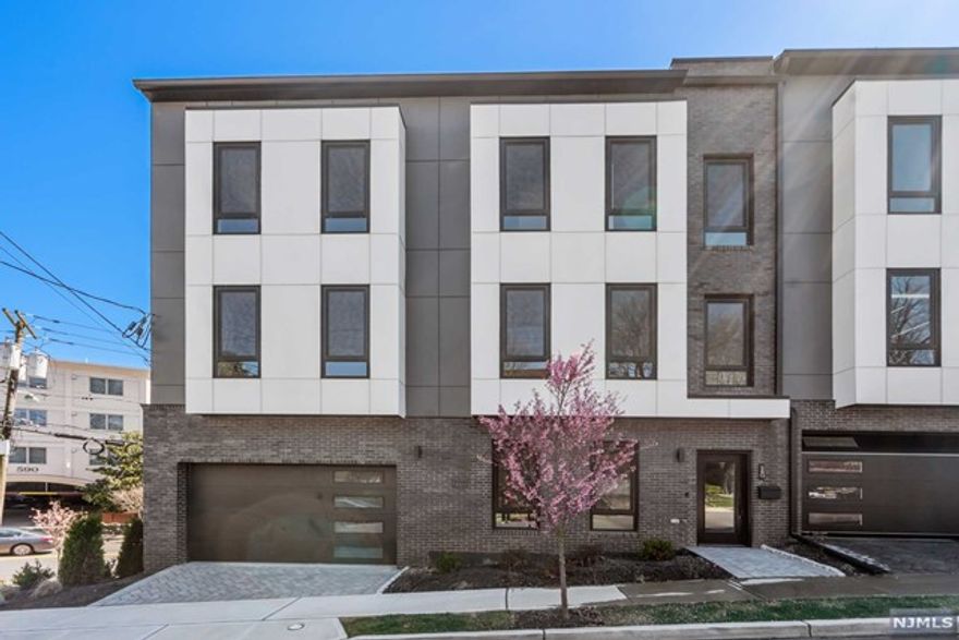 Contact Listing Agent Ryan D'Errico +201-988-4670 for a private tour of this Amazing End Unit. Exclusive collection of sophisticated townhomes in Cliffside. Developed by Premier Developers and styled by VDA design. This unit showcases an upscale kitchen featuring quartz countertops and a Bosch appliance package. The well-designed living room/dining room area boasts a gas fireplace and powder room. The primary suite includes a spa-inspired primary bathroom, accompanied by 2 additional bedrooms and a full bathroom. Top Level expansive rooftop terrace and finished loft room with wet bar. The ground level provides a recreation room, half bath, and attached garage + 1 outdoor spot. Additional highlights comprise recessed LED lighting, oak floors, high-efficiency boiler, multi-zone heating and Central A/C. Situated near Anderson Avenue downtown district and offering convenient access to NYC via ferry or express transportation. Come for a tour!