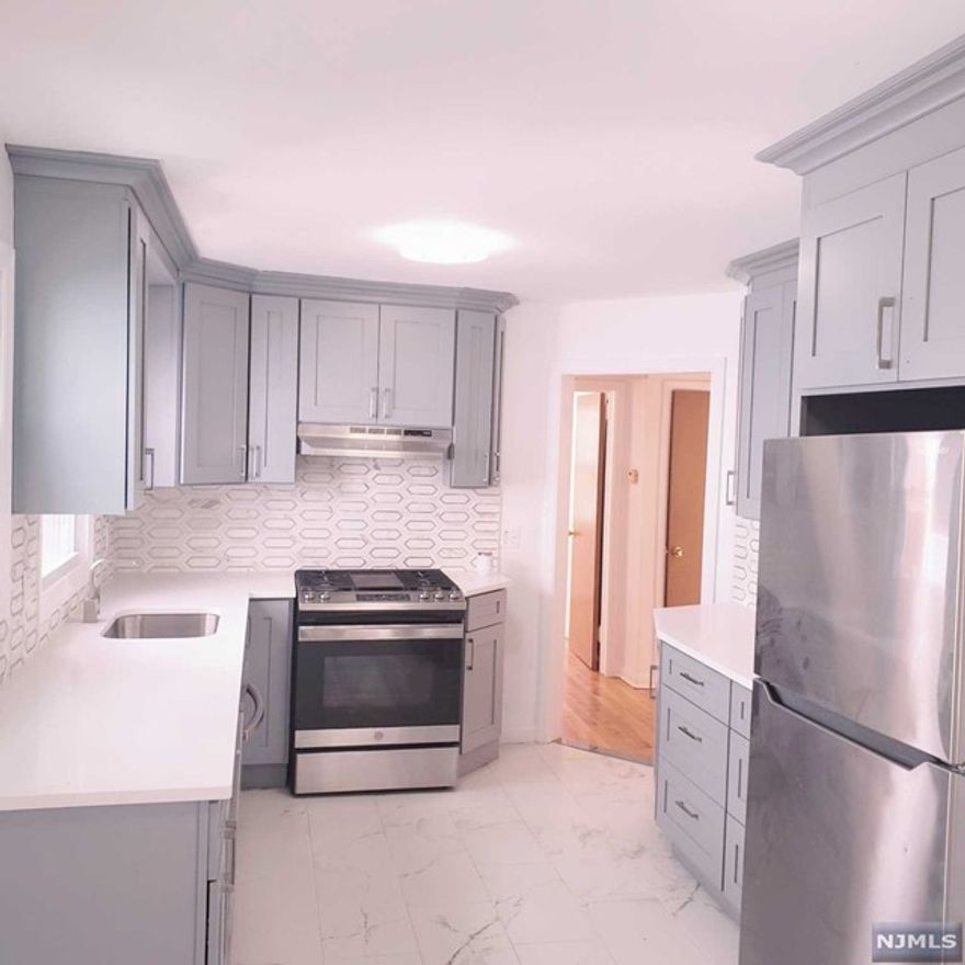 Welcome to a newly renovated 2 spacious bedrooms and Beautifully updated eat- in large kitchen, new dishwasher, stainless steel appliances, gleaming quartz counters and tile backsplash. sunny room with Hardwood throughout to the Pavers Patio to the back yard. with 2 full bathrooms one on the first floor and 2nd at the basement with summer kitchen and 3 bonce rooms and laundry room freshly painted, Conveniently located near public transpiration, shopping, schools and highways. Must carry renter's insurance. No smoking and no pets. This Apartment offers comfort and convenience. MUST SEE!