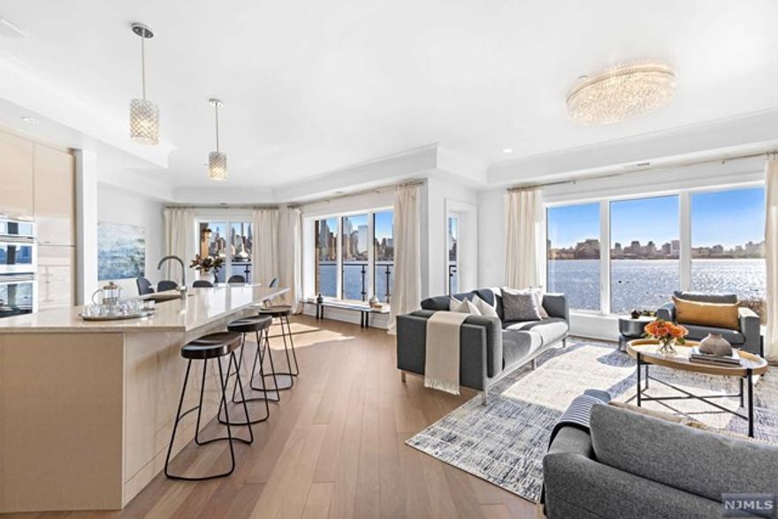 THE CHEN AGENCY (phone 201-346-8888) - HENLEY on HUDSON - Welcome to 150 Henley Place Residence 306. This is the one you have been waiting for. Occupying the most desirable position in the community, this southeast corner front row home boasts 1765-SF with the most awe inspiring unobstructed views of the Hudson River and Manhattan Skyline from every window and the glass-walled wrap-around balcony. Inside this exceptional one-level floorplan, you'll find exquisite finishes including beautiful wood, stone and porcelain tile detailing accompanied by quality fixtures and appliances. Extensive amenities include the concierge, pool, gym and lounges at the Henley Club plus the additional gym and resident lounges found only at 150 Henley Place. A tandem parking space for 2 cars completes this incredible offering. Come experience living here! Contact NELSON CHEN at 201-886-8000 or Nelson@ChenAgency.com