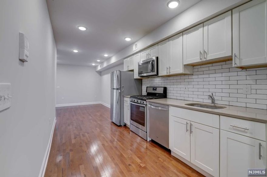 Renovated 2 bedroom 1.5 bathroom apartment located near chopping areas, gyms, schools, very easy access to public transportation. This unit provides very easy access to NY, light rail and busses are walking distance from this unit, buses to Staten Island are also available. Stainless steel appliances include dishwasher, microwave, refrigerator and stove, remote controlled ceiling fans located in each bedroom, there is a laundry area coin operated machines on 1st floor.