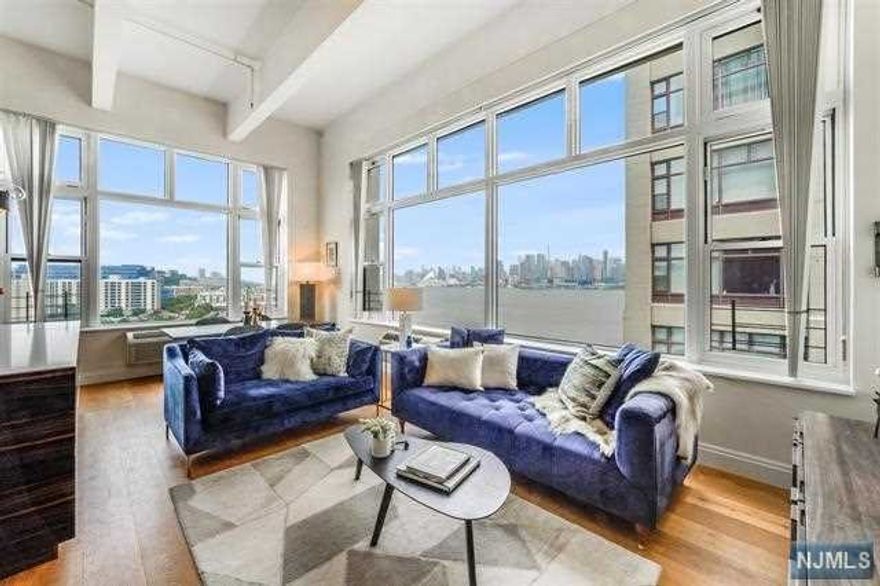 Welcome to this 2-bedroom, 2-bathroom corner unit condo located in the Hudson Tea Building which has stunning panoramic views of the iconic New York City skyline. Situated in a prime location, this apartment offers modern comfort in a vibrant urban atmosphere. Upon entering the apartment, you are greeted by an open and spacious living area, featuring large windows that allow natural light to flood the space while offering breathtaking panoramic views of the NYC skyline. The living room is designed to be both stylish and functional, providing ample space for entertaining guests or simply relaxing and enjoying the scenery. Adjacent to the living area is a fully equipped modern kitchen, which features designer kitchen w/Wolfe, Thermador & Miele Appliances, including wine fridge & built-in coffee maker. Italian custom cabinetry w/automatic open upper cabinets, Porcelanosa backsplash, Groehe & Kohler fixtures, pot filler & farmhouse sink. The unit boasts two well-appointed bedrooms.