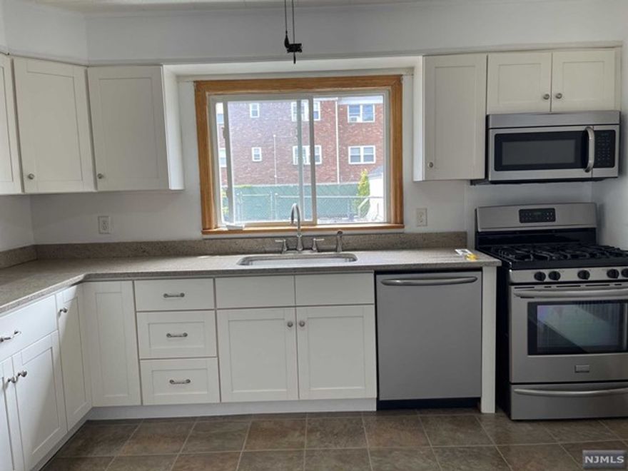 Welcome to this wonderfully updated and spacious two bedroom apartment. First floor apartment includes two great sized bedrooms, full bath, eat in kitchen & living room. Large eat in kitchen with white soft close cabinets, granite countertops and stainless steel appliances including: refrigerator, gas stove, microwave & dishwasher. Ample amount of closet space. Hardwood flooring throughout main living areas. Freshly painted, new ceiling fans and more. Window/ Wall A/C units. Radiator heating. Street parking only, no laundry & no pets please. Close to food stores, dunkin donuts, laundry mat, cvs, schools, restaurants, worship, city transportation and so much more! GREAT LOCATION!!