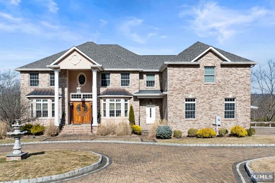 Stunning luxury home in one of Montville's most desirable communities Bear Rock Estates. Meticulously maintained, a truly remarkable, one of a kind home that combines luxury comfort and convenience. Over 5,100 sq ft, five bedrooms, four full and one half baths, two fireplaces with three attached garages. This spacious home offers a formal living room, a formal dining room adjacent to the kitchen and a family room that lead to newly installed deck with peaceful, relaxing views of the woods. The first floor bedroom with one full bath plus four additional bedrooms and three full bath on second floor. The walk-out finished basement is perfect for many recreational options and storage. Easily accessible to major highways, NYC train, bus and shopping centers.