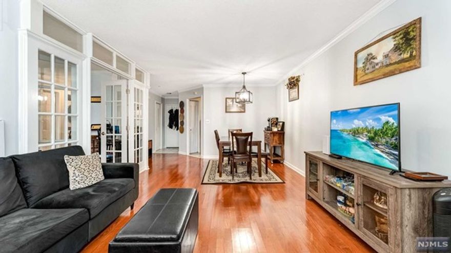 Welcome to this renovated condo in Harmon Cove's Luxury Community with High Ceilings, Beautiful hardwood floors, In unit washer and dryer and a large porch facing the beautiful city views. Offering a 24 hour doorman, elevator, and a large porch facing the pool, sauna, storage unit's onsite, and a large playroom. A commuters dream with a onsite parking garage, bus transportation arrives at your building.