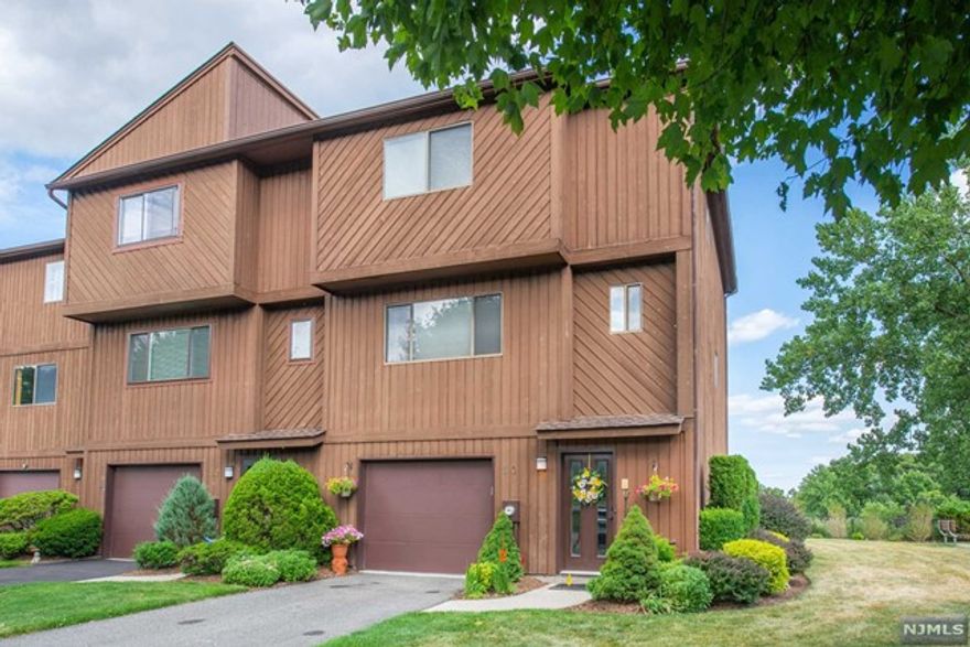 Welcome to The Highview, a lifestyle that won't disappoint. This end unit townhome is immaculate and ready to show you just what it can do for you! The ground level has an oversized garage with plenty of storage, a multitude of closets, a full bath, a living room or bedroom with a walkout to the yard. The second floor is where the fun begins with stunning views of the NYC skyline off your private deck. All classy updates throughout this home make it very easy for you to just bring your toothbrush. The kitchen was recently updated with high-end cabinetry, custom backsplash, high hats and more...The third floor is everything you need to rest and relax. A generous sized bedroom accompanies the master bedroom with a completely renovated bathroom with jetted tub. Don't forget to enjoy the view from your Master bed. Not that it can get any better but it does with your laundry outside your bedroom. Come see what this home can do for your lifestyle.